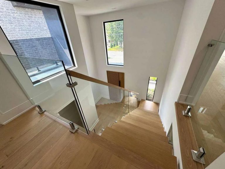 Glass Stair And Landing Railing With Wood Top Rail